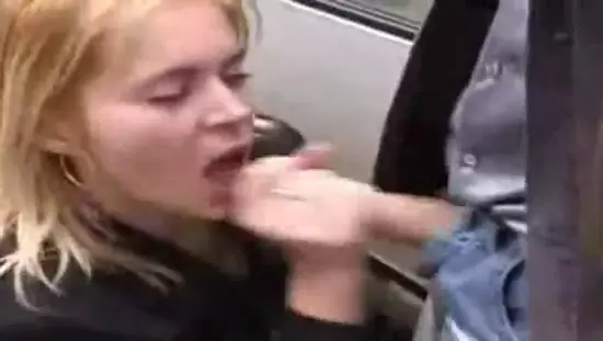 Woman giving blowjob to a man in public street