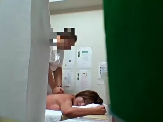 A woman in a bikini stands on a bed hospital room