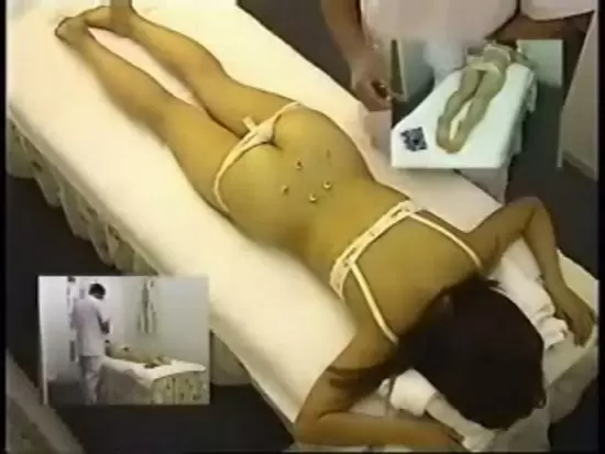 A woman is being tied to a bed for a sexual activity